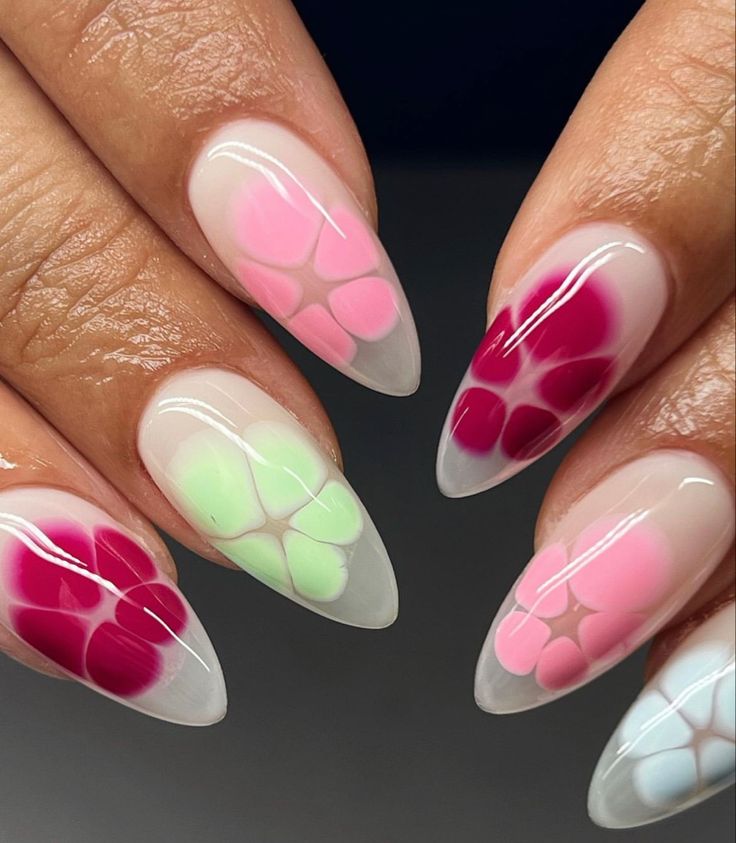 Trendy Gradient Floral Nail Design in Soft Pink, Red, and Pastel Green.