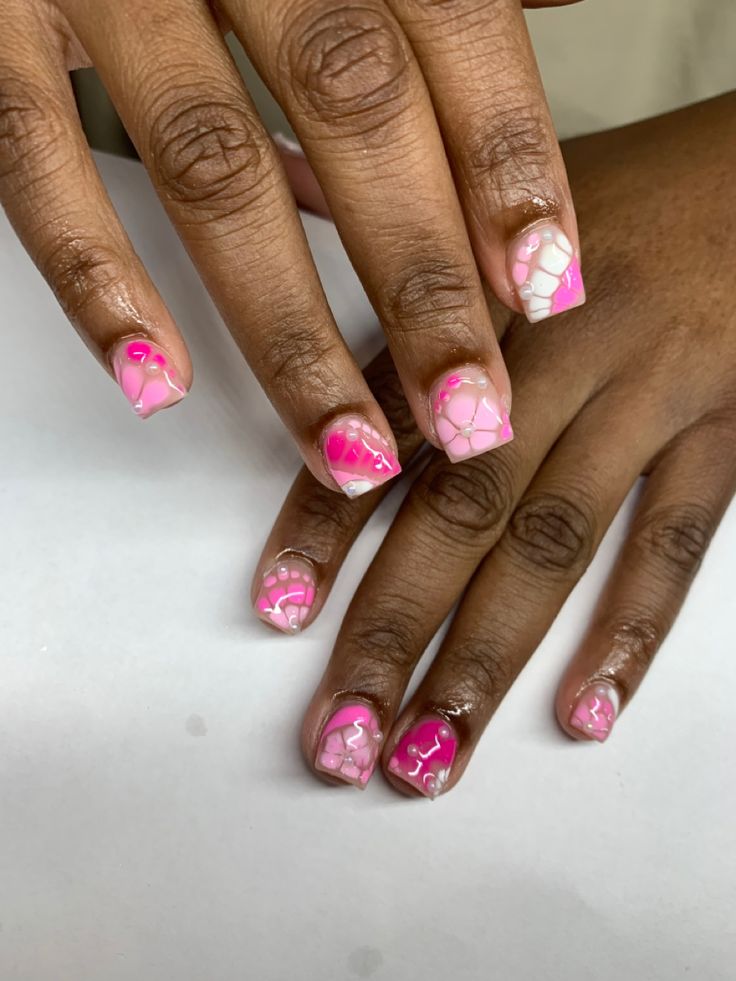 Playful Modern Nail Art: Glossy Soft Pink and Vibrant Magenta Swirls and Abstract Patterns.