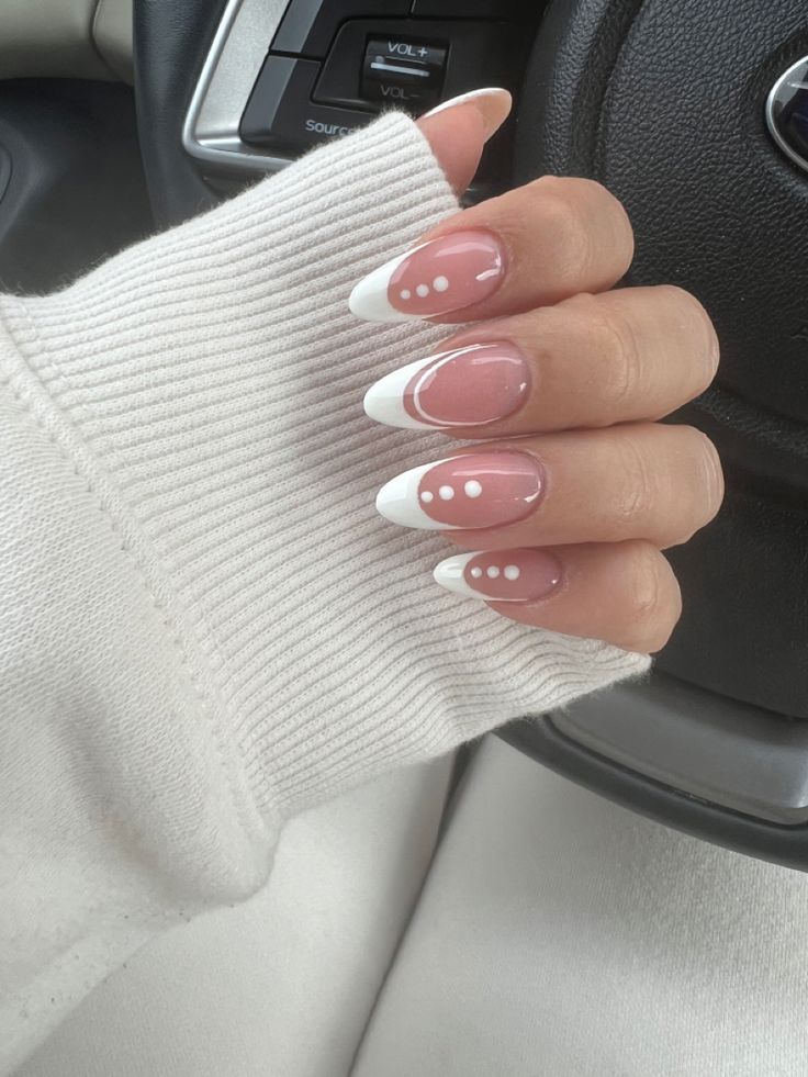 Chic French Tip Nail Design with Soft Pink, White Dots, and Half-Moon Accents.