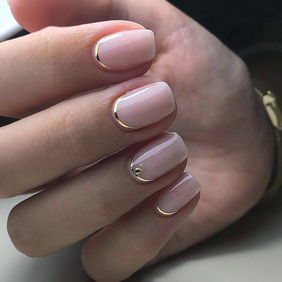 Chic Blush Pink Nail Design with Gold Tips and Rhinestone Accent