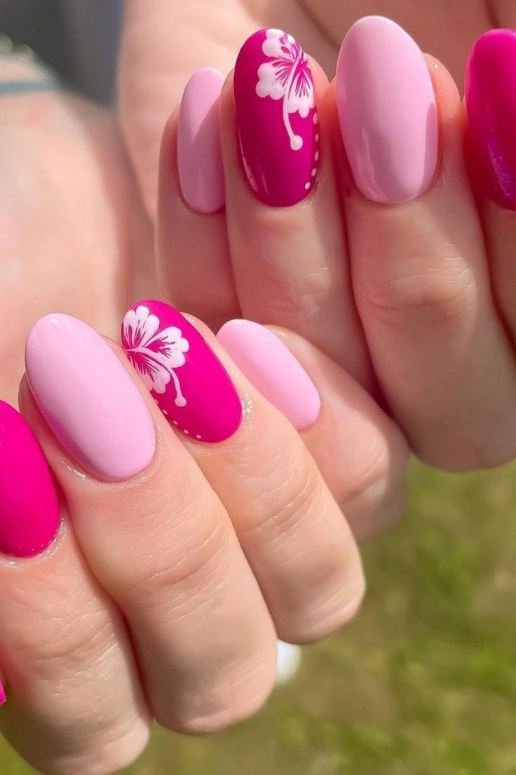 Vibrant Summer Nail Design with Floral Accents and Glossy Finishes.