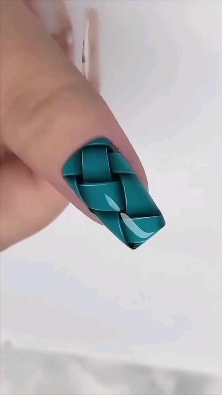 Intricate Textured Teal Nail Design with Woven Pattern and Elegant Accents.