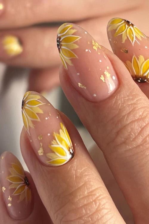 Cheerful Floral Nail Design: Bright Sunflowers on Elegant Nude Base with Gold Flakes