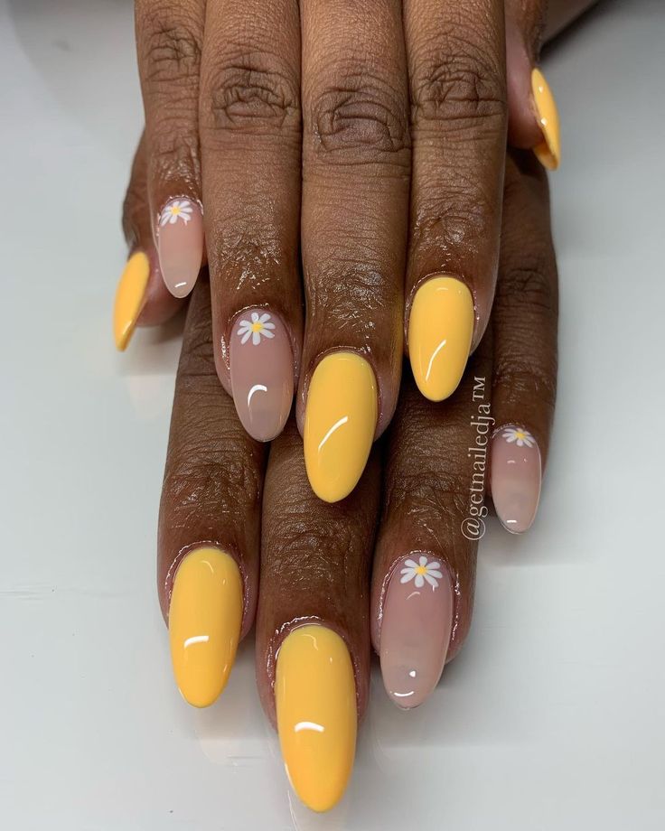 Cheerful Spring-Summer Nail Design: Bright Yellow and Nude with Daisy Accents