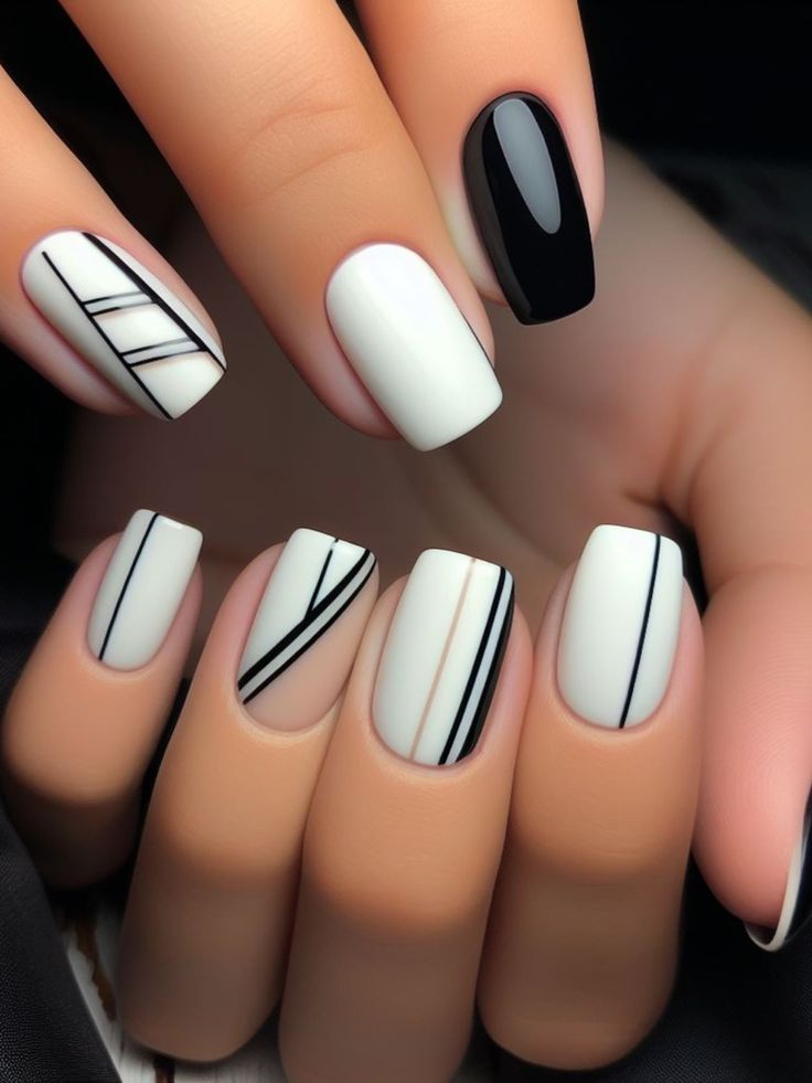 Chic Geometric Nail Design: Matte White and Glossy Black with Stylish Line Details