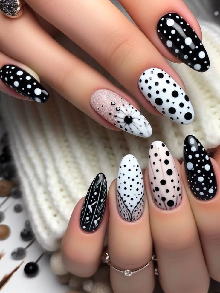 Chic Black and White Nail Design with Creative Dot Patterns and Geometric Accents.