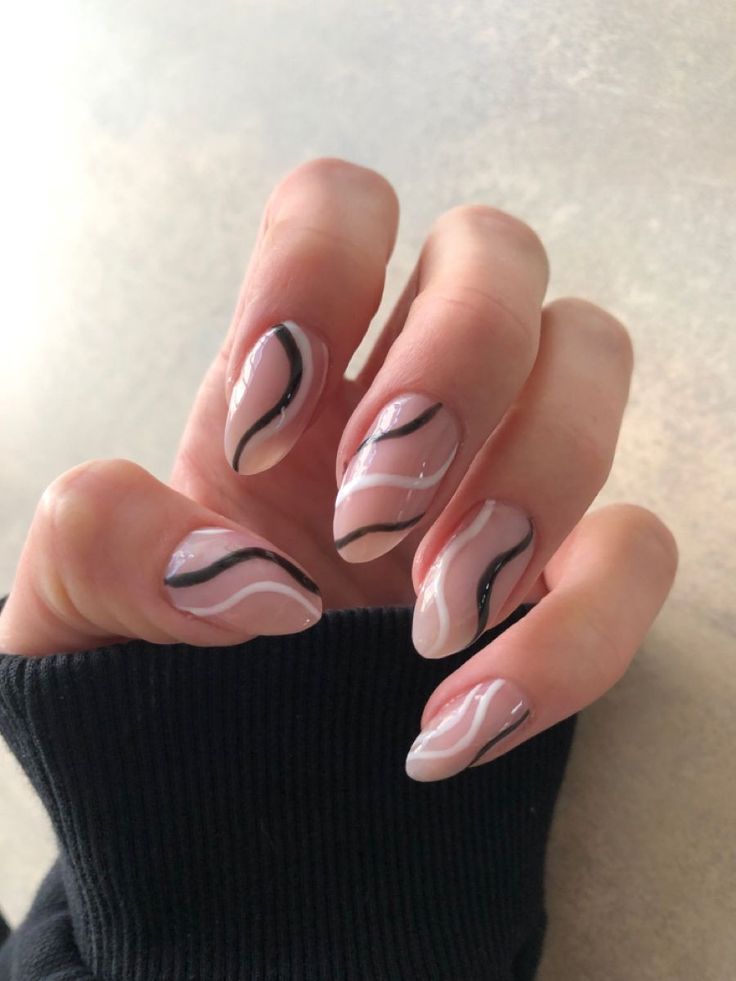 Chic Nail Art: Soft Curved Lines in Muted Pink and Black.