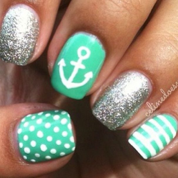 Vibrant Mint Green Nautical Nail Design with Polka Dots and Glitter Accents for a Chic Summer Look.