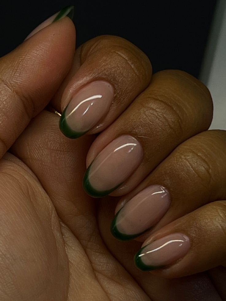 Chic Nude and Green French Tip Nail Design: A Modern Botanical Aesthetic.