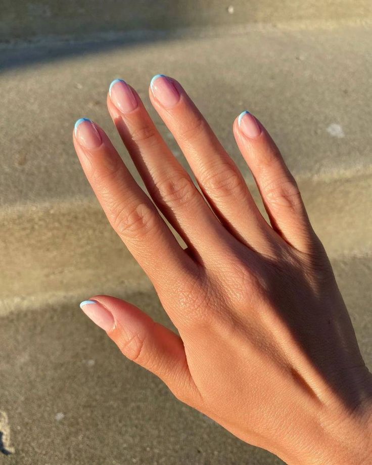 Sophisticated Nude Nail Design with Delicate Pastel Blue Tips