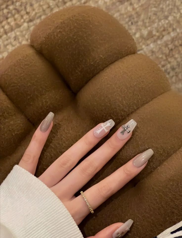 Chic Neutral Nail Design with Artistic Accents and Geometric Patterns