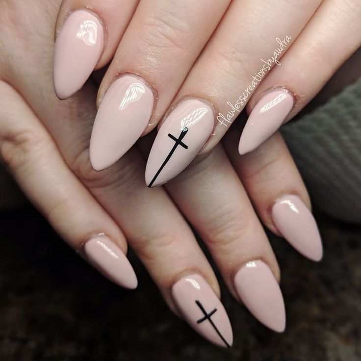 Chic Almond-Shaped Nude Nails with Bold Black Cross Accent.