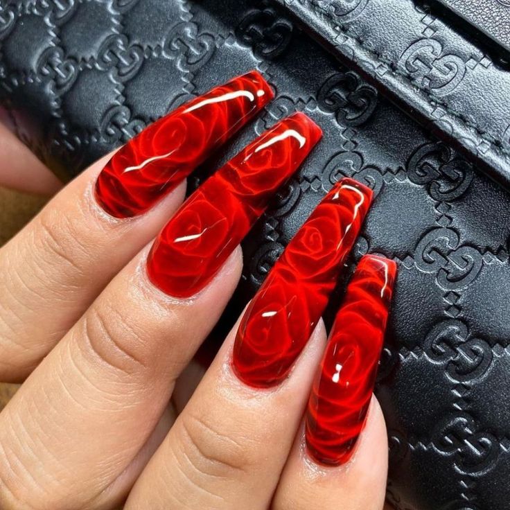 Sophisticated Long Red Rose Nail Design with Intricate Floral Patterns.