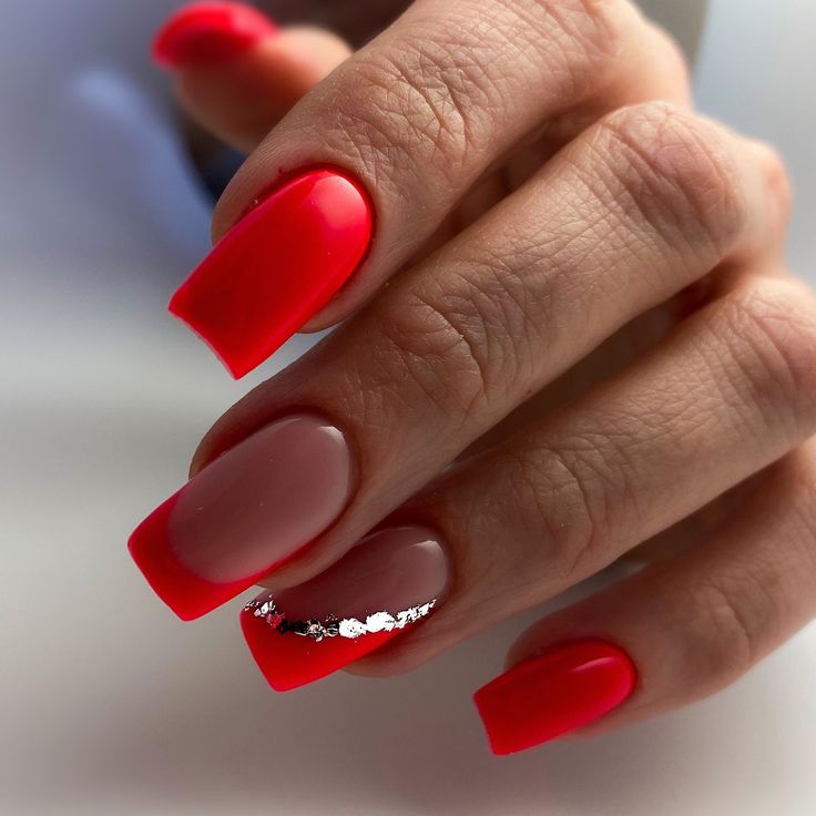 Elegant Bold Nail Design: Striking Red and Soft Nude with Glamorous Silver Accents.