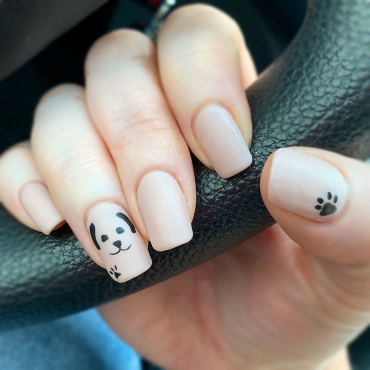 Minimalist Panda-Themed Nail Design with Soft Nude Base and Playful Artwork.