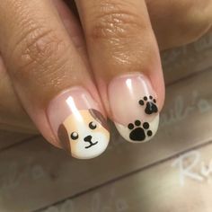 Chic Dog-Themed Nail Design Featuring Adorable Puppy Face and Paw Print.