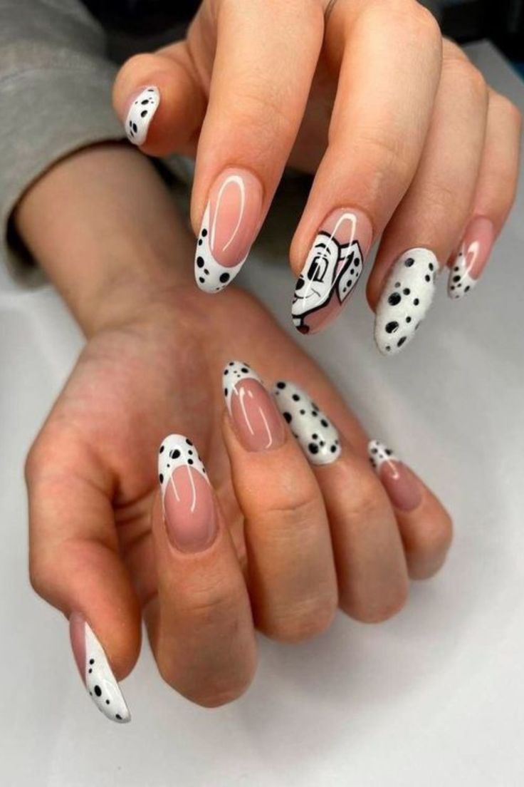 Chic Nail Design: Soft Nude and White Base with Trendy Black Dots and Stylish Motif.