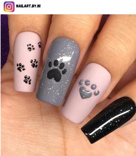 Playful Paw Print Nail Design with Pastel Backgrounds and Glossy Glitter Accents.