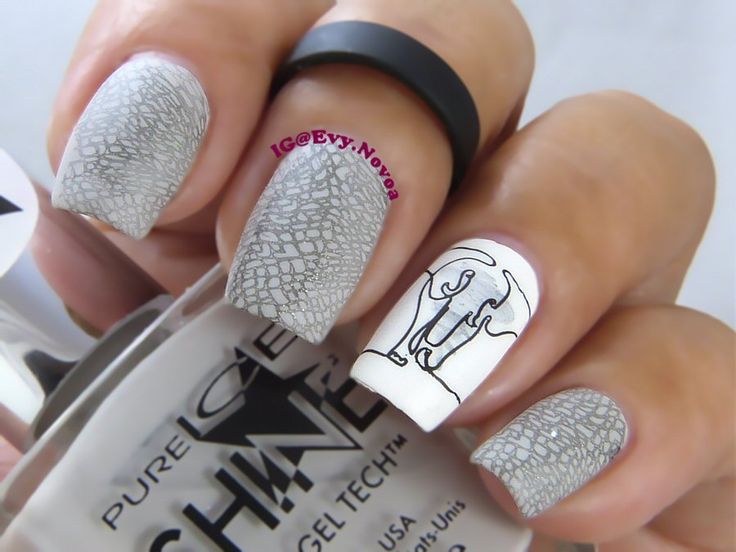 Artistic Textured Grey Nail Design with Crackle Effect and Playful Accent