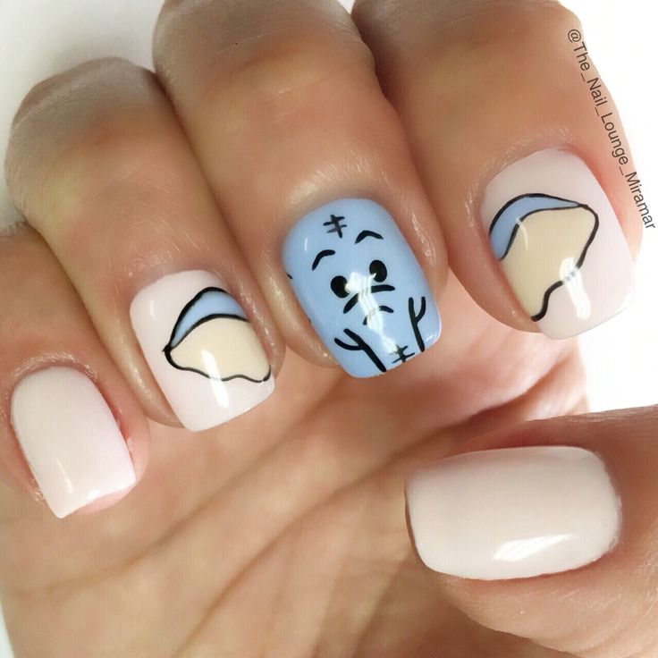 Whimsical Light Blue Character Nail Design with Soft Pastels and Creamy Beige Accents.