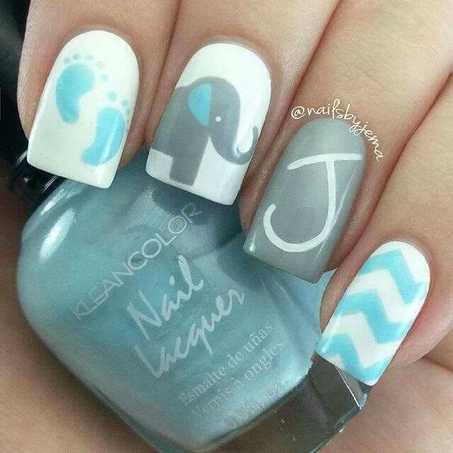 Playful Colorful Nail Design with Adorable Elephants and Chevron Patterns.