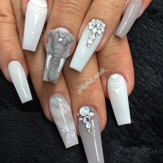 Sophisticated Gray Nail Design with Sculpted Elephant Accent and Lace Details.