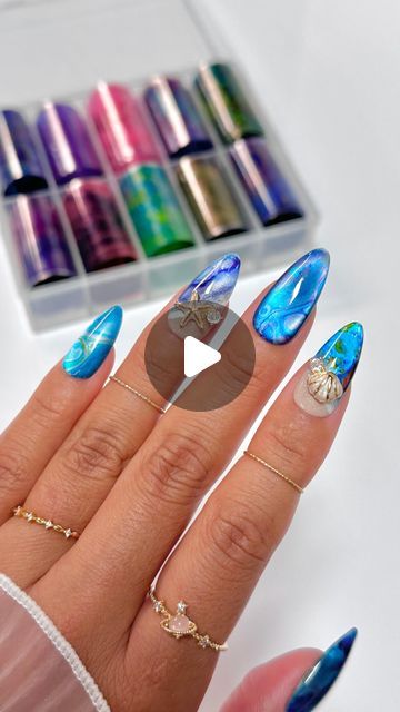 Tropical-Inspired Nail Design: Blue Hues with Starfish and Seashell Accents