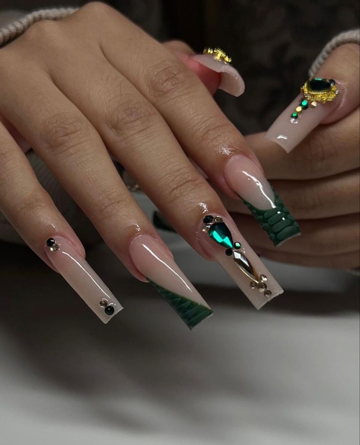 Glamorous Nude and Green Textured Acrylic Nails with Faux Leather Tips and Sparkling Embellishments.