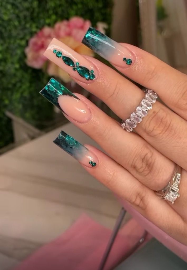 Glamorous Ombre Nail Design with Sparkling Gems and Intricate Detailing