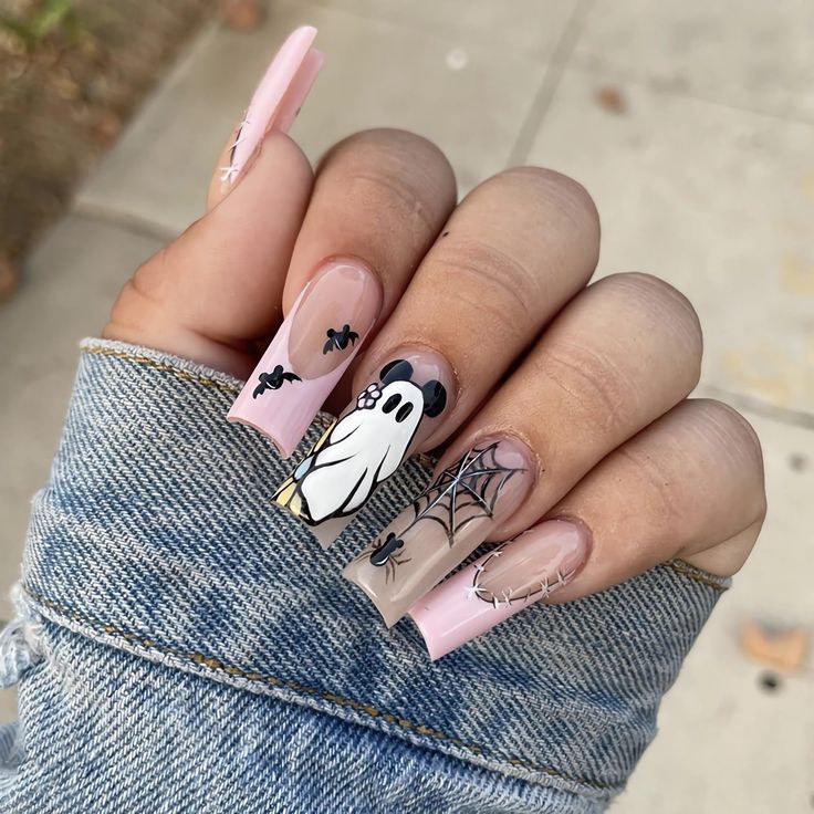 Whimsical Halloween Nail Design with Ghosts, Spider Webs, and Soft Pink Accents.