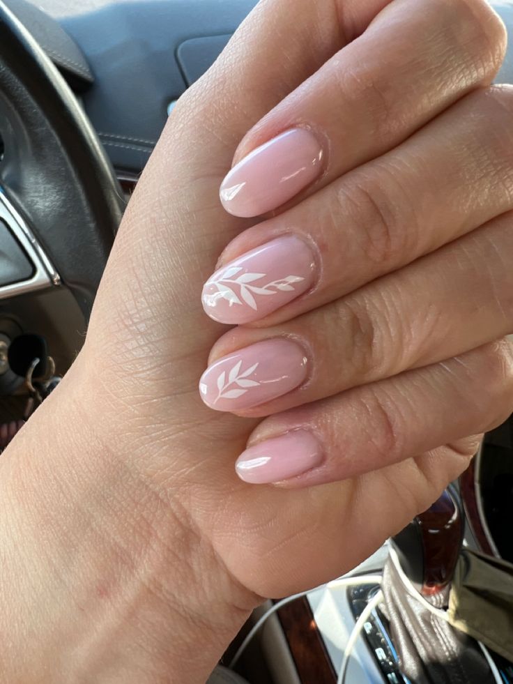 Sophisticated Chic: Elegant Pink Nail Design with White Leaf Patterns