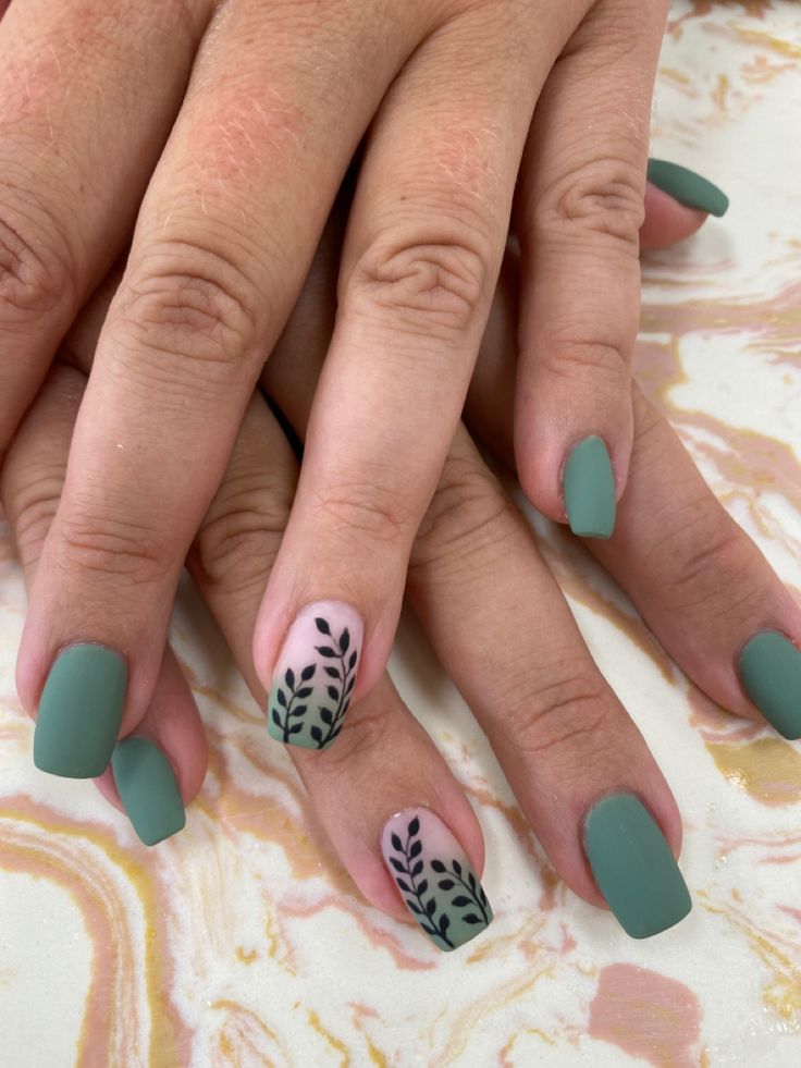 Sophisticated Muted Green Nail Design with Delicate Leaf Accents