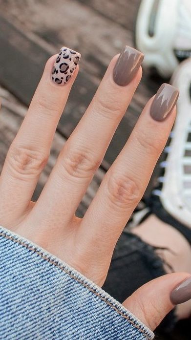 Chic Neutral Nail Design with Bold Leopard Accent.