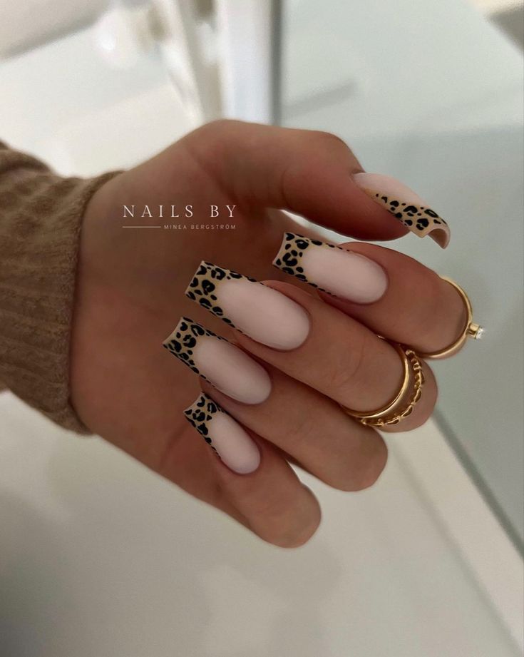 Chic Leopard Print Accent on Long Nude Square Nails with Gold Ring Accents.