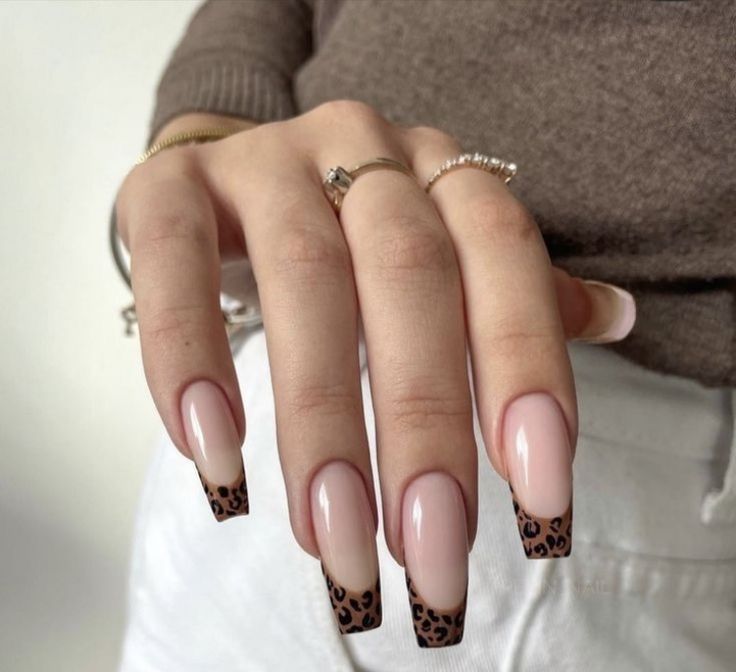 Sophisticated Leopard Print Tip Nails with Elegant Nude Base and Gold Accents.