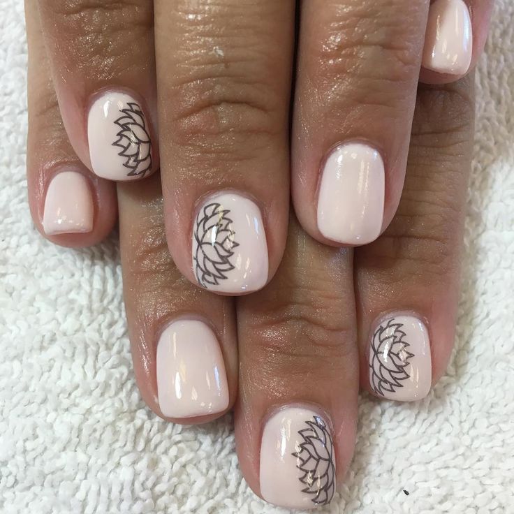 Sophisticated Nude Nail Design with Intricate Lotus Flower Artistry.