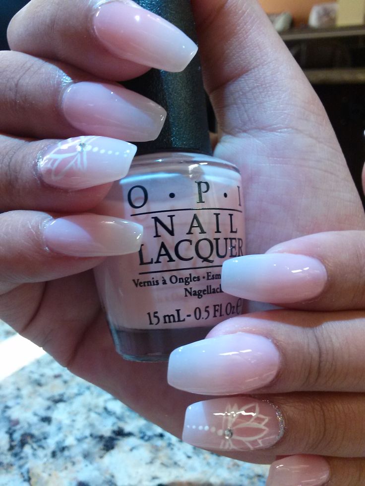 Chic Soft Ombre Nail Design with Intricate Floral Accents and Sophisticated Embellishments