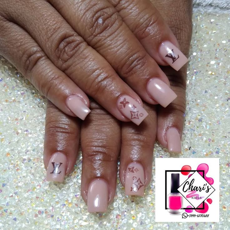 Chic Nude Nail Design with Luxury Motifs for Understated Glamour