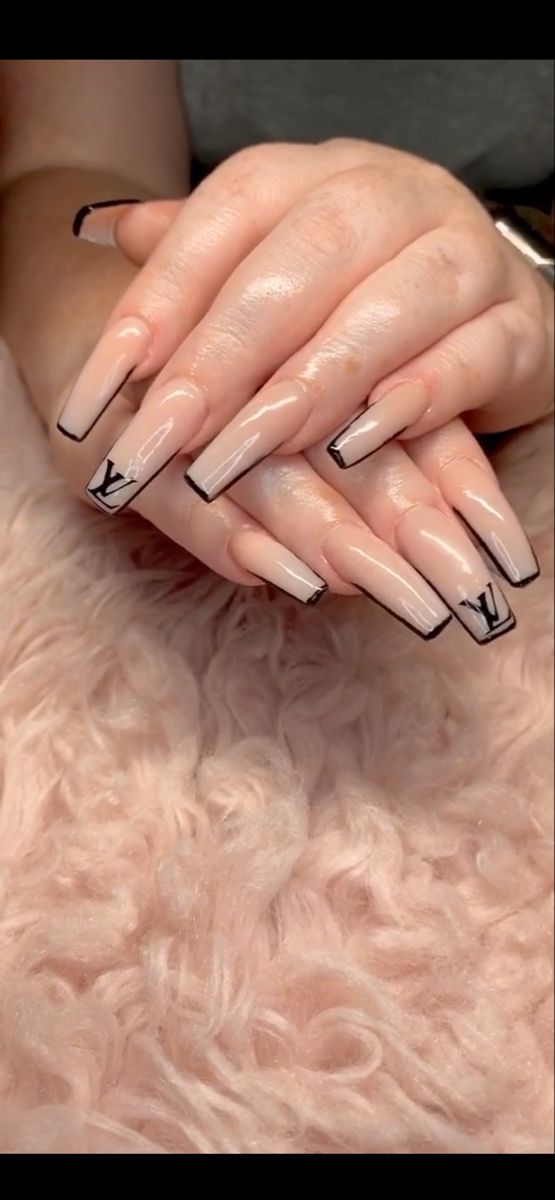 Chic Nude and Black Tip Manicure with Elegant Border Designs.