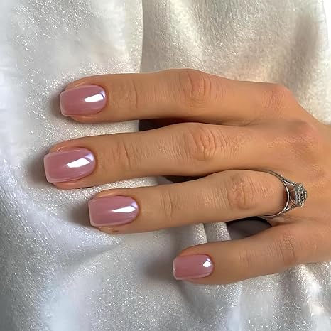 Sophisticated Glossy Nude Nail Design with Soft Pink Hues for Elegant Versatility.