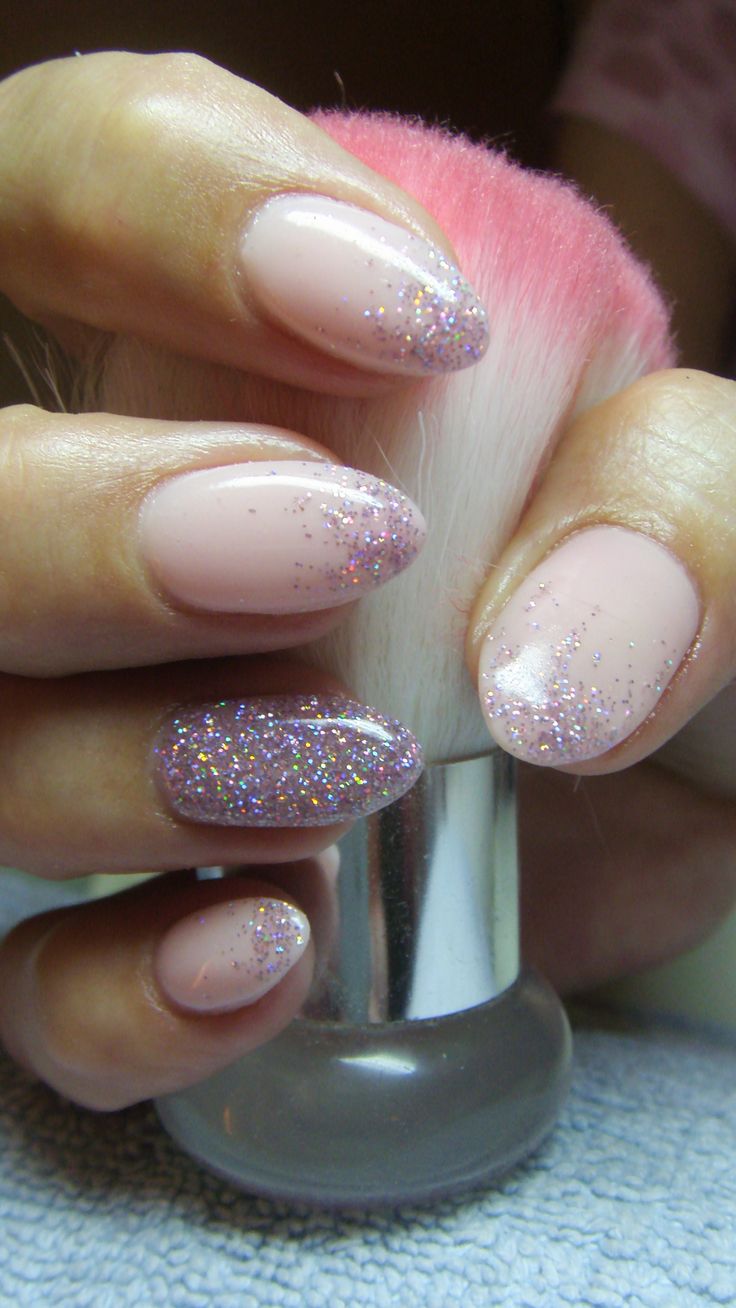 Elegant Glittery Pink Gradient Nail Design with Sparkling Accents.