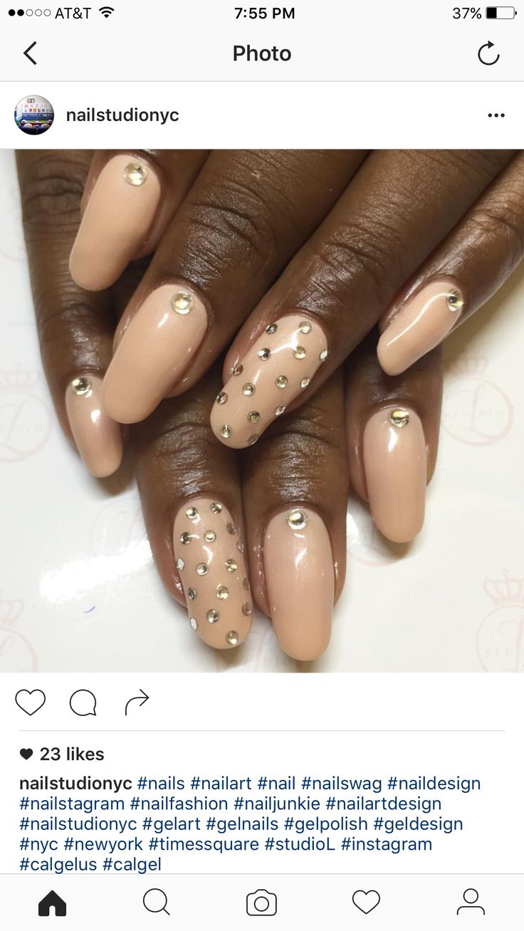 Chic Nude Nail Design Adorned with Intricate Rhinestones for Any Occasion.