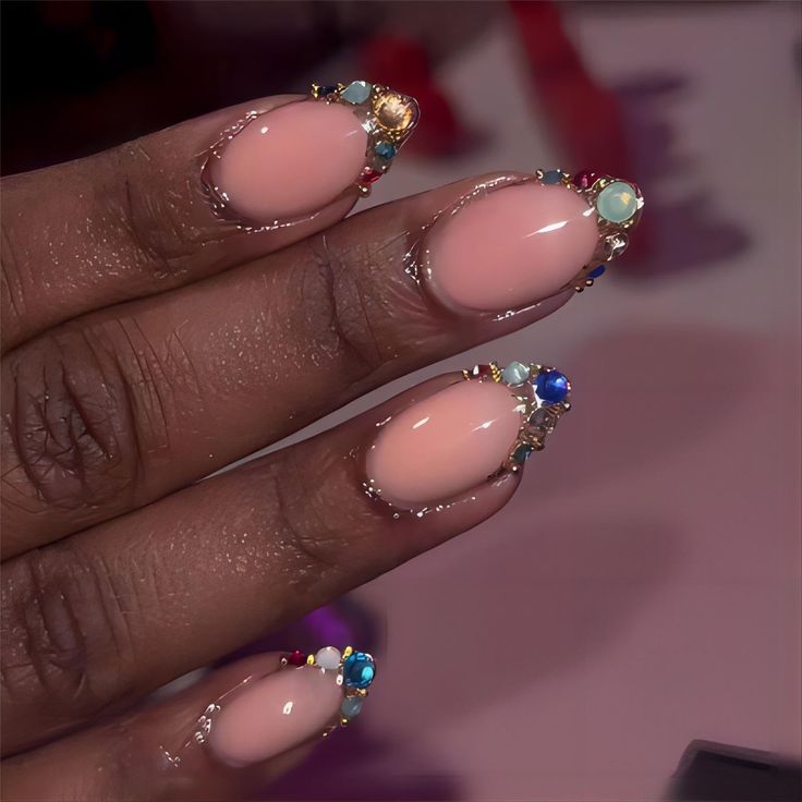 Chic Nude Nail Design Adorned with Glamorous Gemstones.