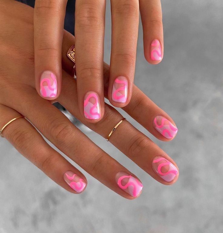 Playful Vibrant Pink Nail Design with Abstract Swirls and Glossy Finish for Elegant Style.