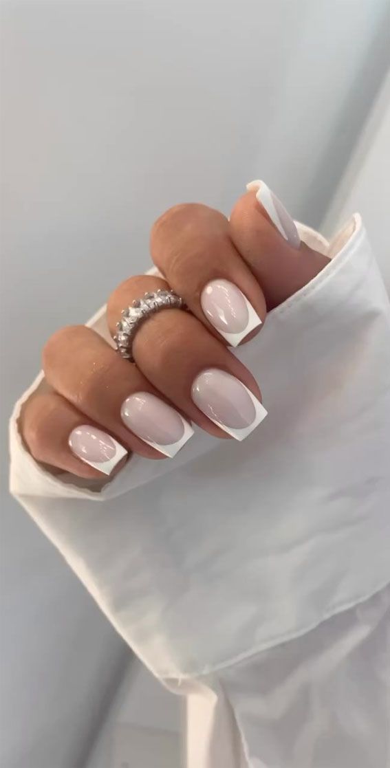 Modern French Manicure: Elegant White Base and Tips for a Chic Minimalist Look.