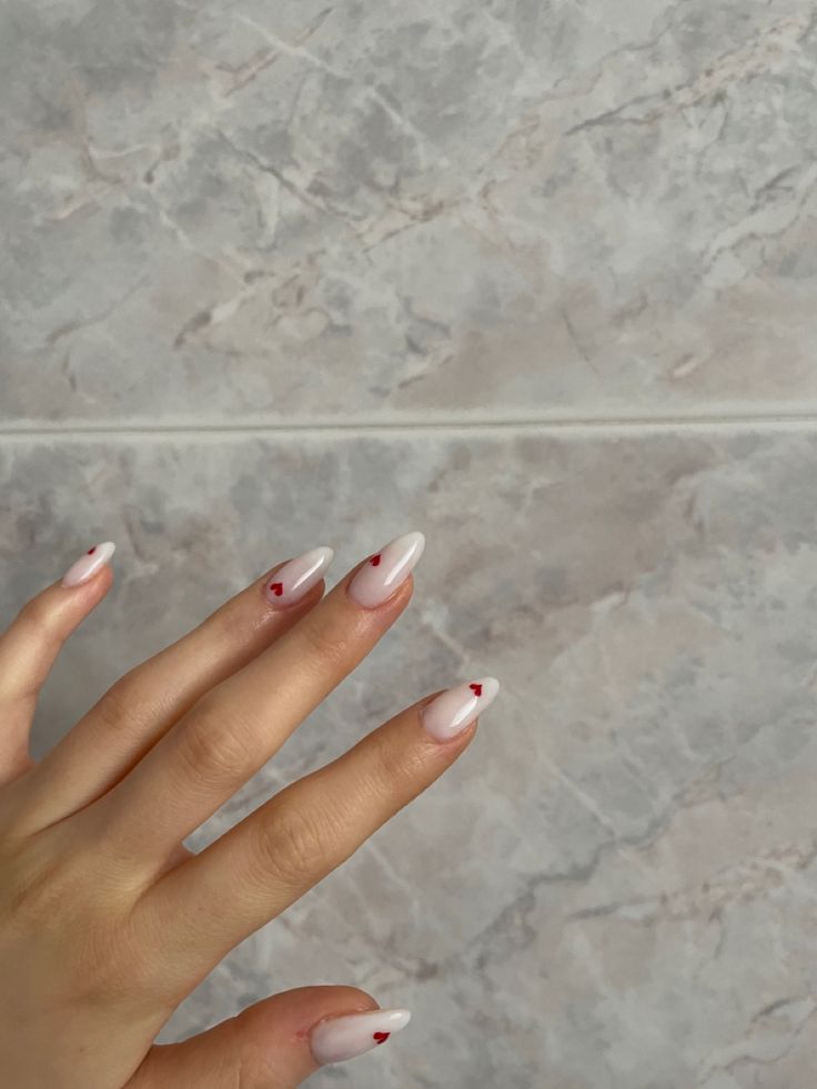 Charming Ombre Nail Design with Heart Accents for Any Occasion