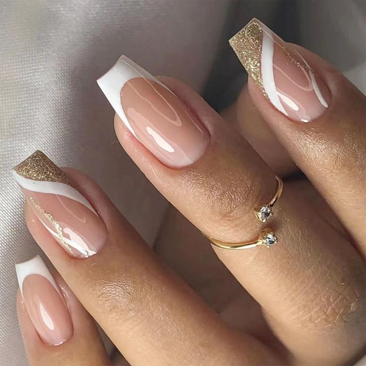 Chic Nude, White, and Gold Ombre Nail Design with Modern Geometric Patterns.