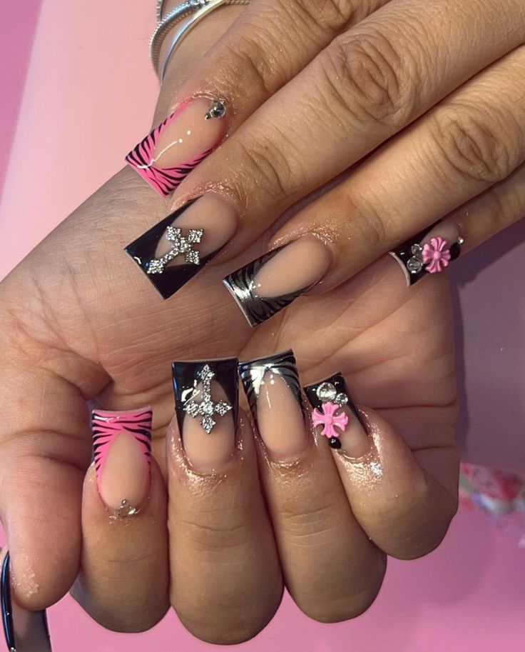 Bold and Elegant Intricate Nail Design with Glossy Black, Vibrant Pink, and Floral Accents.