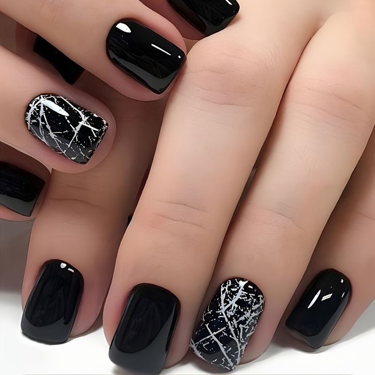 Elegant Chic Black Nail Design with Glossy Finish and Striking White Accents.