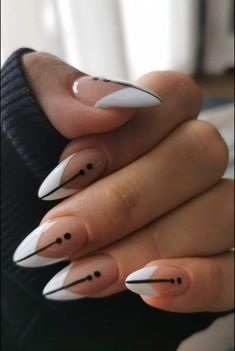 Edgy Chic: Diagonal Nail Design with Minimalist Black Accents on White Base